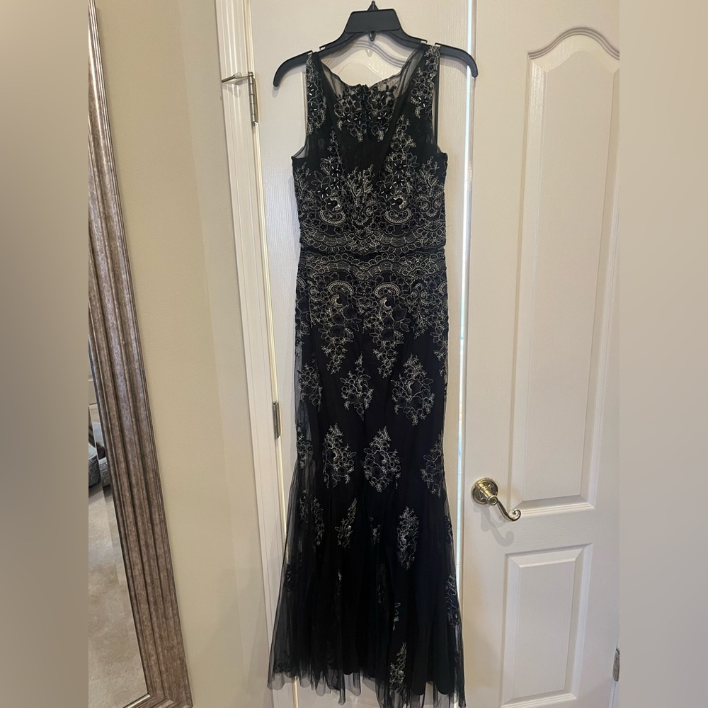 Beautiful formal gown. Black and silver beaded. Excellent condition!